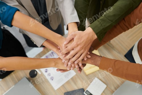 Preview: Business People Stacking Hands