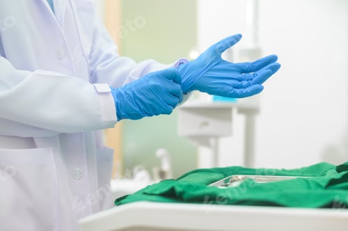 Preview: Female dentist wearing medical gloves Prepare to work in a dental clinic, dental concepts and health
