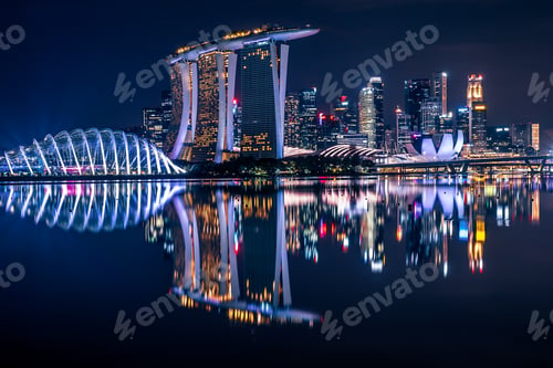 Preview: Reflection of Singapore’s Marina Bay skyline at twilight.