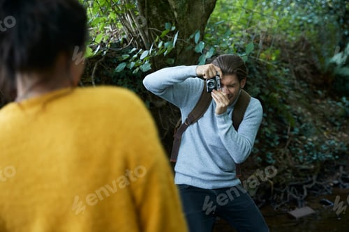 Preview: Hiker couple taking photograph at walk