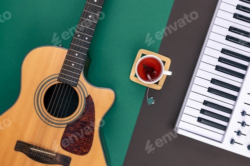 Preview: Guitar, musical keys and a cup of tea on a colored background, top view.