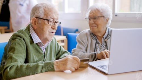 Preview: Senior people trying to shop online with laptop
