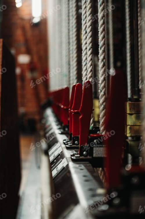Preview: Closeup shot of a row of stage ropes against a blurry background.