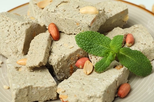 Preview: Halva with nuts and mint on plate, close up