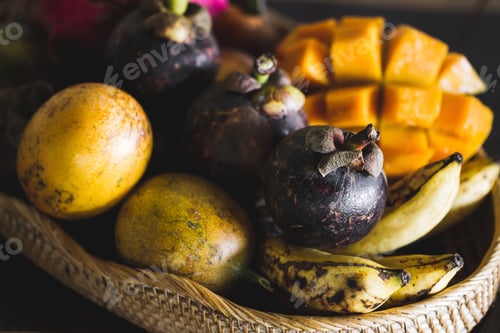 Preview: Fruit plate with mango, passion fruit, mangosteen, dragonfruit on wooden table