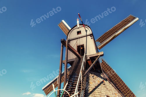 Preview: Colorful spring day with traditional Dutch windmills canal in Ro