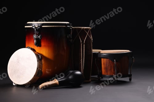 Preview: Different drums on a black background, percussion musical instruments