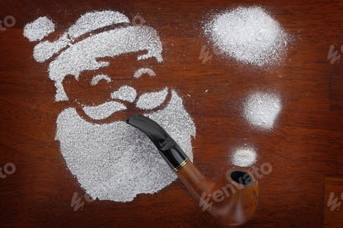 Preview: Santa Made Of Snow Spray Smoking Pipe On Wooden Background