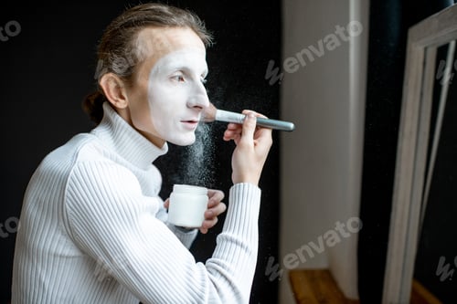 Preview: Actor applying makeup on his face