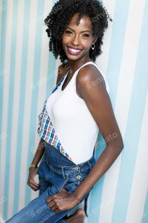 Preview: Woman posing by the wall