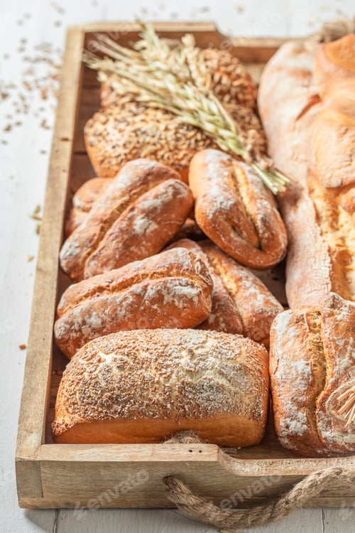 Preview: Rustic baguettes and buns baked in bakery. Made of wheat.