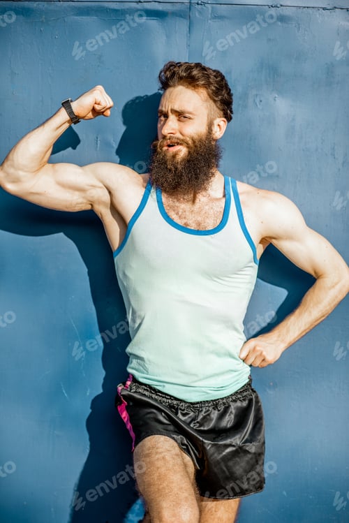 Preview: Portrait of an old-fashioned athlete on the green background