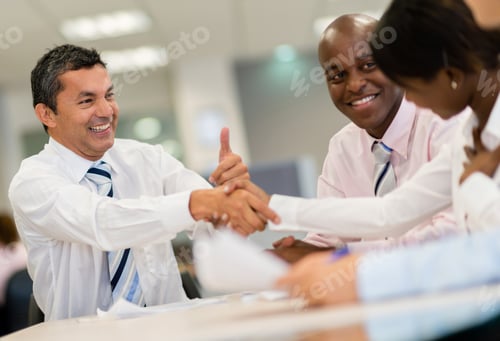Preview: Successful Group Of Business People Closing Deal With A Handshake