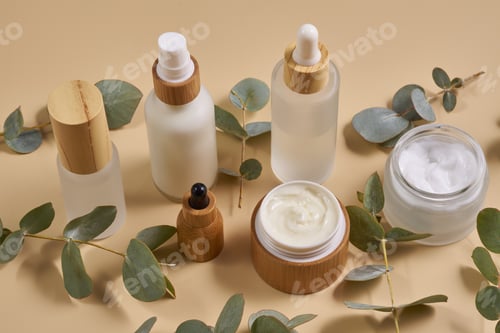 Preview: Natural cosmetics in bamboo glass packaging on white background. SPA organic beauty products set.