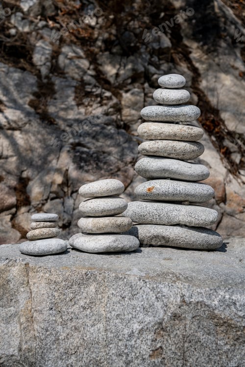 Preview: three pyramids of white stones.