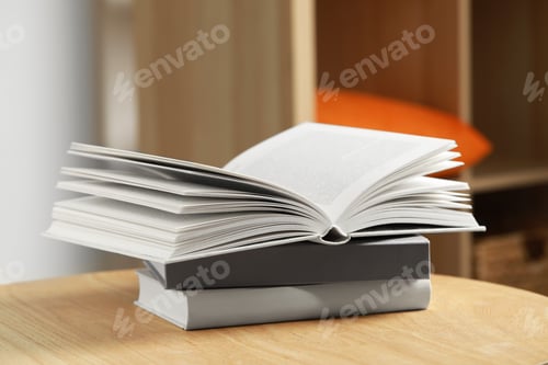 Preview: Stack of different books on wooden table indoors
