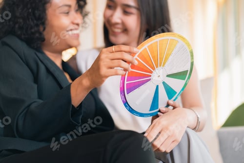 Preview: Diverse woman color wheel creative team casual meeting happy mood joyful color wheel discussion