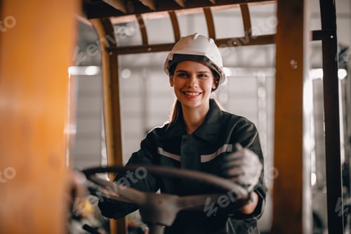 Preview: Female robotic technician schedules maintenance and runs forklift, in inclusive workplace.