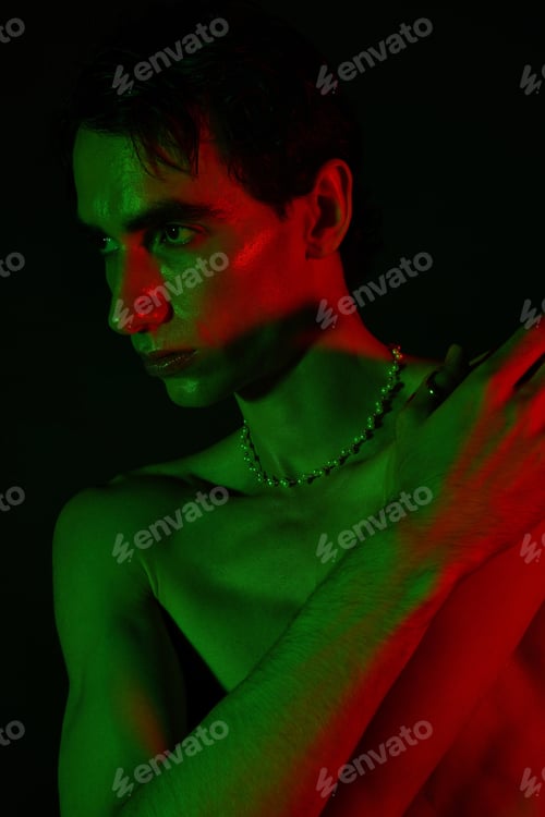 Preview: Bold contrasts and striking features highlight a mans unique style in a vibrant setting