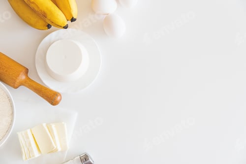Preview: Baking Ingredients on a White Table