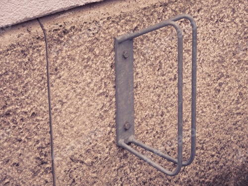 Preview: Closeup of a fixed wall-mounted cycle rack