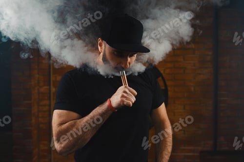 Preview: Man vaping an electronic cigarette