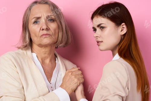 Preview: Mom and daughter hug together family caring pink background