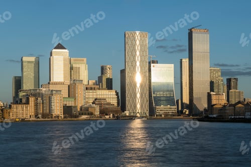 Preview: Dusk settles on a modern city skyline, reflecting the last rays of the sun