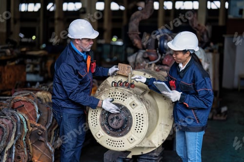 Preview: Maintenance manager and engineer checking part large engine supercharger prepare for overhaul repair