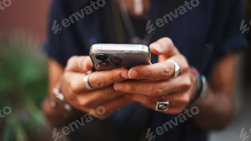 Preview: Close-up of male hands in bracelets and rings