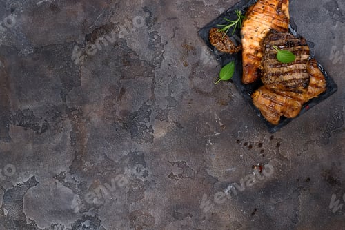 Preview: Fresh three types of grilled steak (chicken, pork, beef) on slate plate with herbs