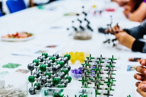 Preview: Group of students in biology class creating molecular models with educational toys.