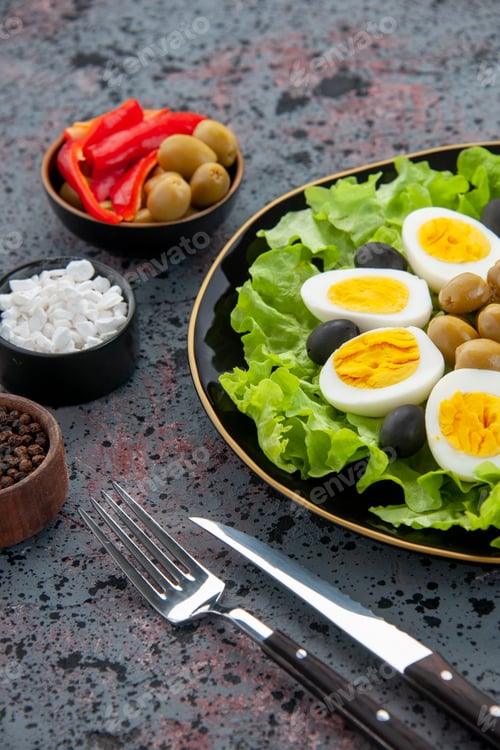 Preview: front view egg salad consists of green salad and olives on light background tea bread breakfast
