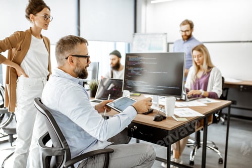 Preview: Programmers working at the office