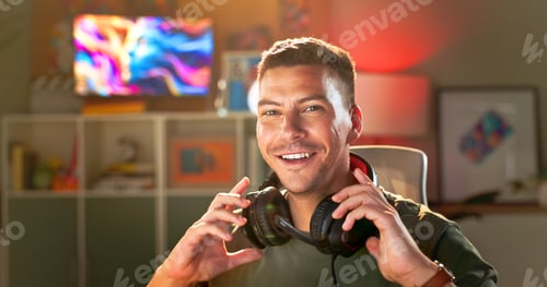 Preview: Happy man, portrait and gamer with headphones for online tournament, streaming or esport at home. Y