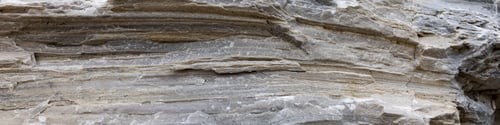 Preview: Layered natural stone in Alps with deep cracks. 4x1 Banner to websites, social network or printing