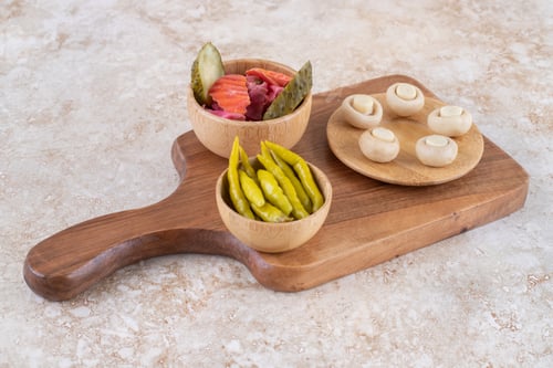 Preview: A wooden board of various vegetables on a marble background