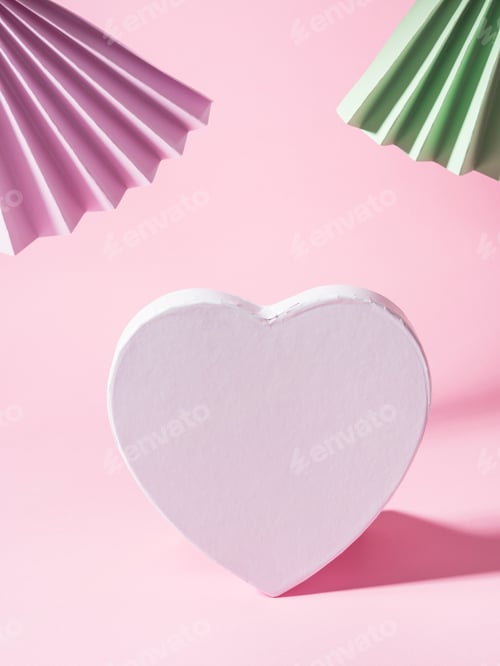 Preview: Geometrical pink background with paper fans and blank white heart shape