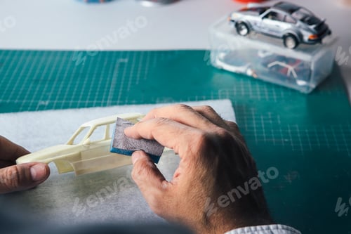 Preview: Unrecognizable person polishing slot car