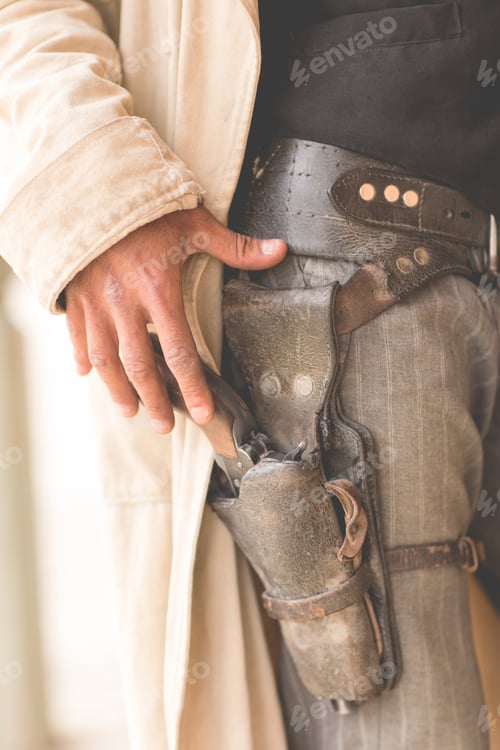 Preview: Cropped close up of cowboys gun holster on wild west film set, Fort Bravo, Tabernas, Almeria, Spain