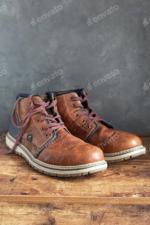 Preview: travel vintage old boots shoes at wooden desk table