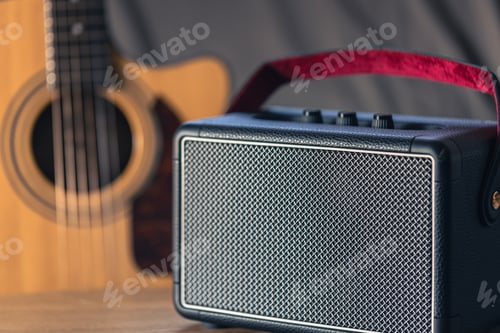 Preview: Close up, music speaker and acoustic guitar in the interior of the room.