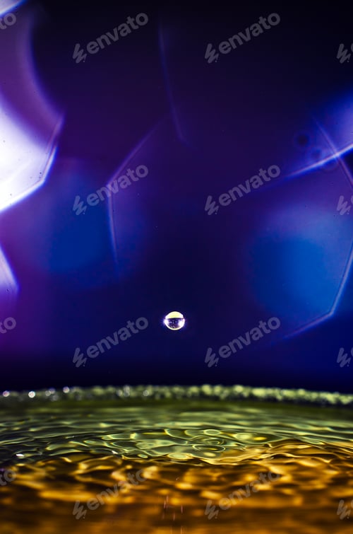 Preview: The water drop with interesting colorful blurred background