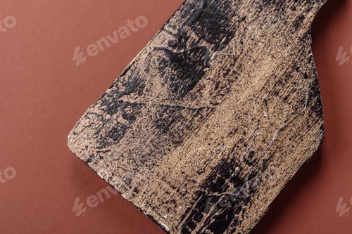 Preview: Empty wooden cutting board on a monochrome brown background
