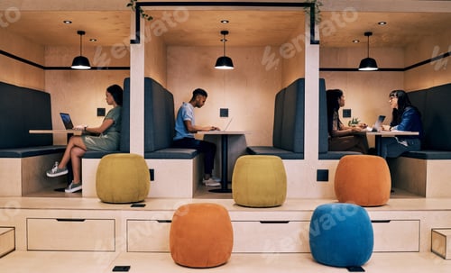 Preview: A calm clean space is best to work in. Shot of creatives working in cubicles.