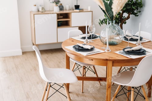 Preview: Served dining table in a modern Scandinavian kitchen.