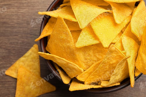 Preview: Tortilla chips (nachos) on wooden table, flat lay