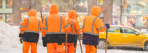 Preview: groop of city janitors stand in snowy street