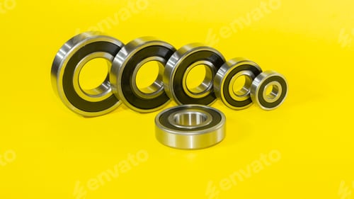 Preview: Closeup shot of ball bearings isolated on a yellow background