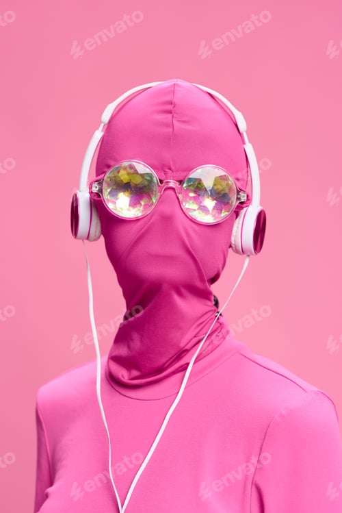 Preview: A crazy conceptual portrait of a young woman without a face mask on a pink background and wearing